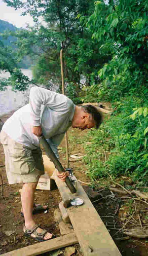Roman Kyshakevuc working on the banks of a river