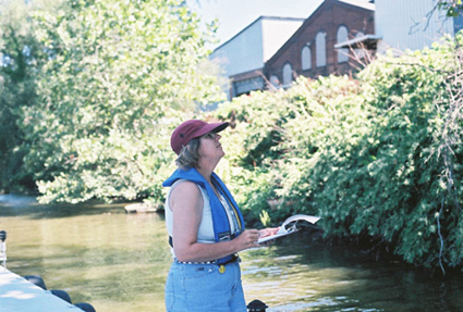 Sue Thompson doing field work on the river